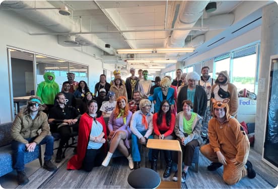 Our incredible employees sitting and showing off their pearly whites while learning about how to help our customers save money on their real estate