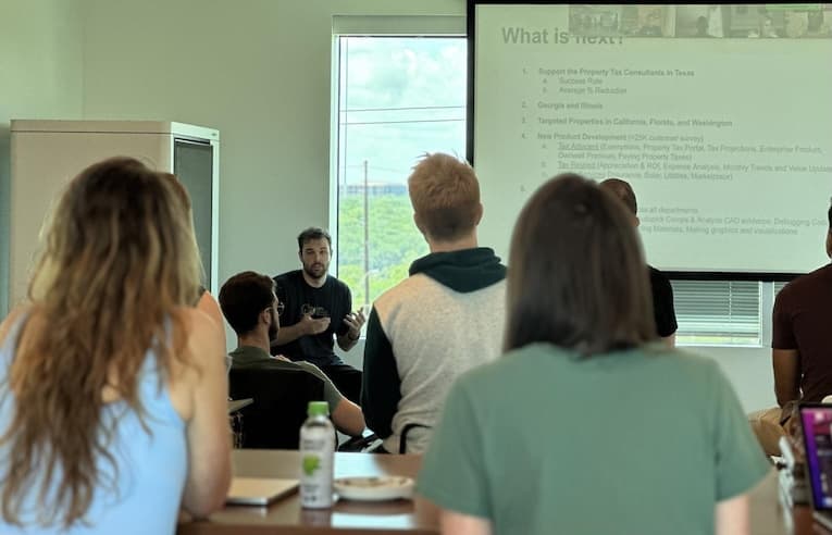 Our awesome employees posing for the camera after a lake cleanup event in Austin